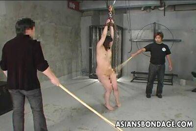 Two dominant men harshly whip submissive bound Asian teen babe - bdsm.one