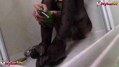 Tattooed Onix Babe takes a shower wearing pantyhose catsuit - pornoxo.com