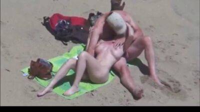 Beautiful blonde gets groped on a nude beach - sunporno.com