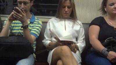 Cute blonde in white dress flashes her panties in train - sunporno.com